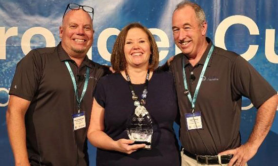 Nexus’ WIMS Program Director, Emily Ryback, accepting the award.